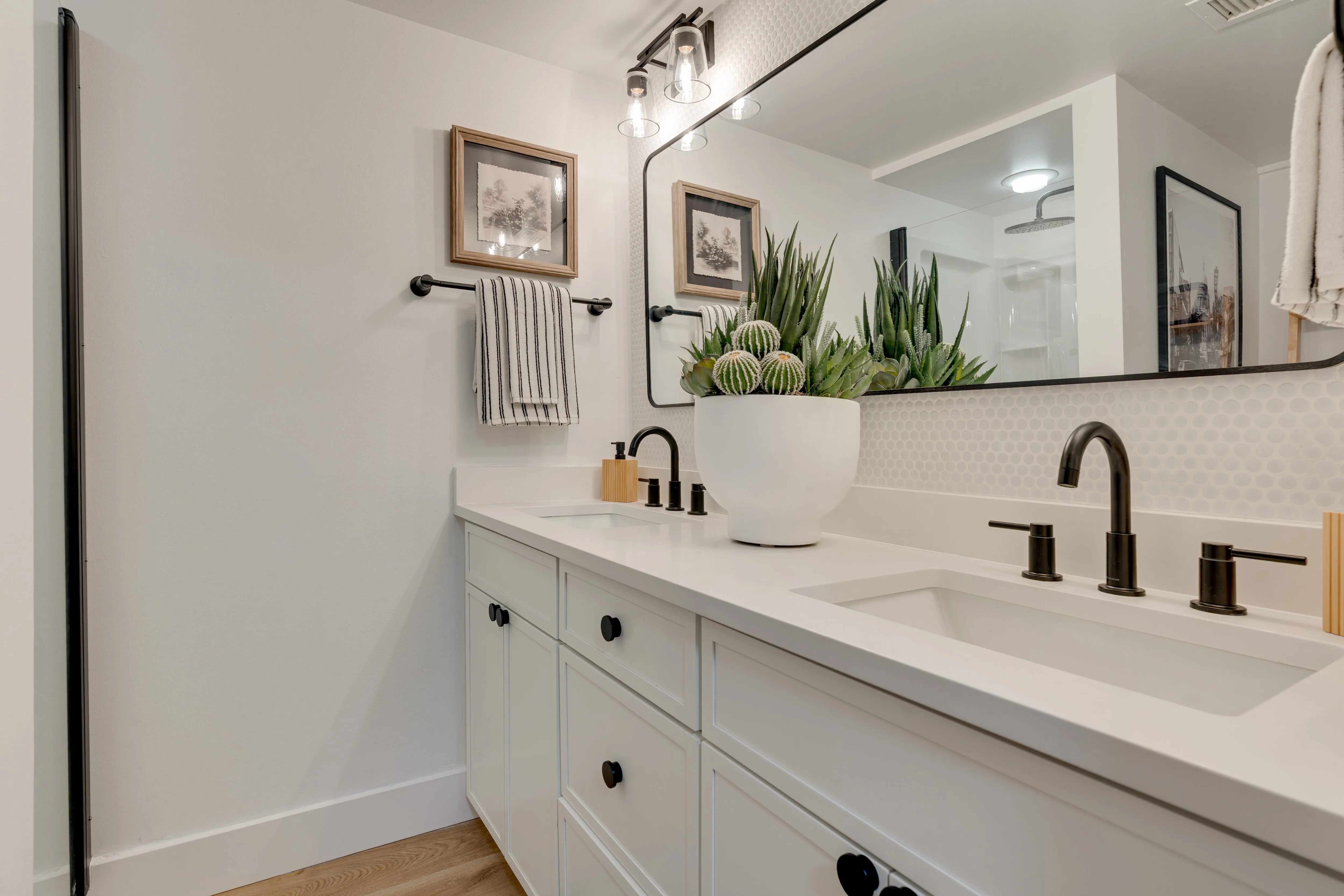 Buckner bathroom with double-sink vanity and large mirror