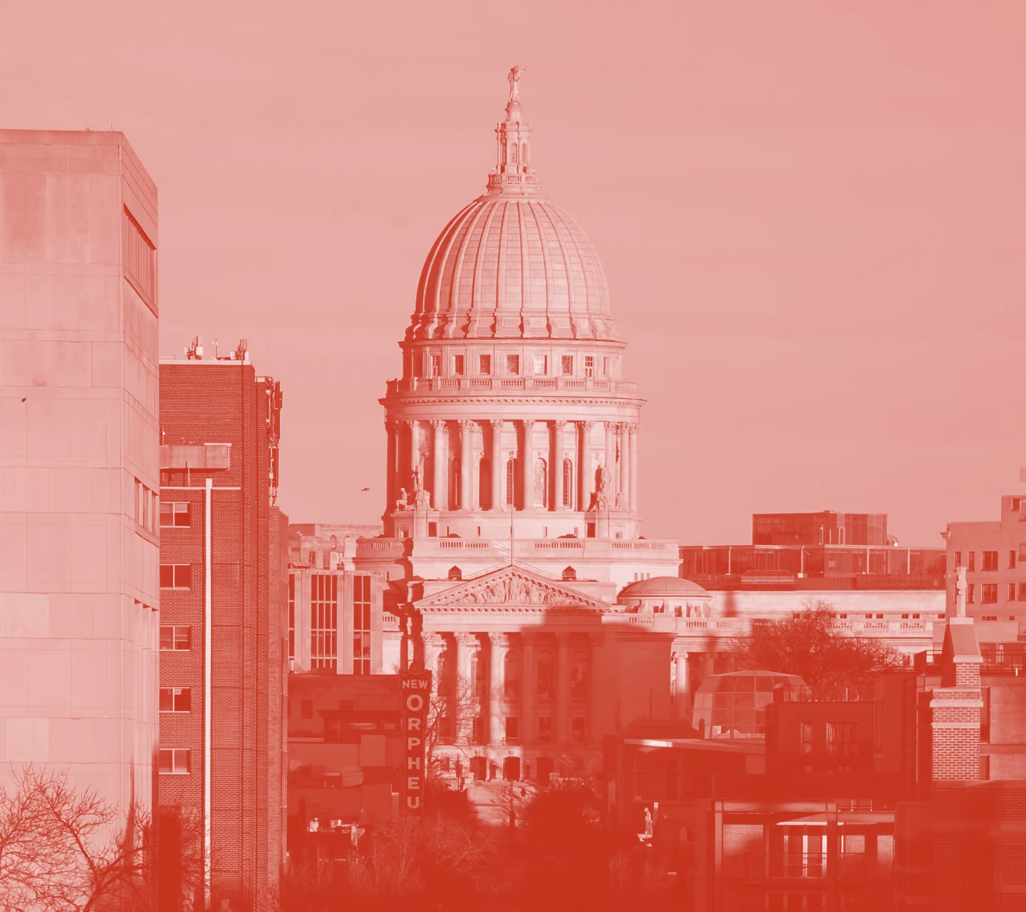 The Wisconsin State Capitol dome over downtown Madison in a red duotone treatment