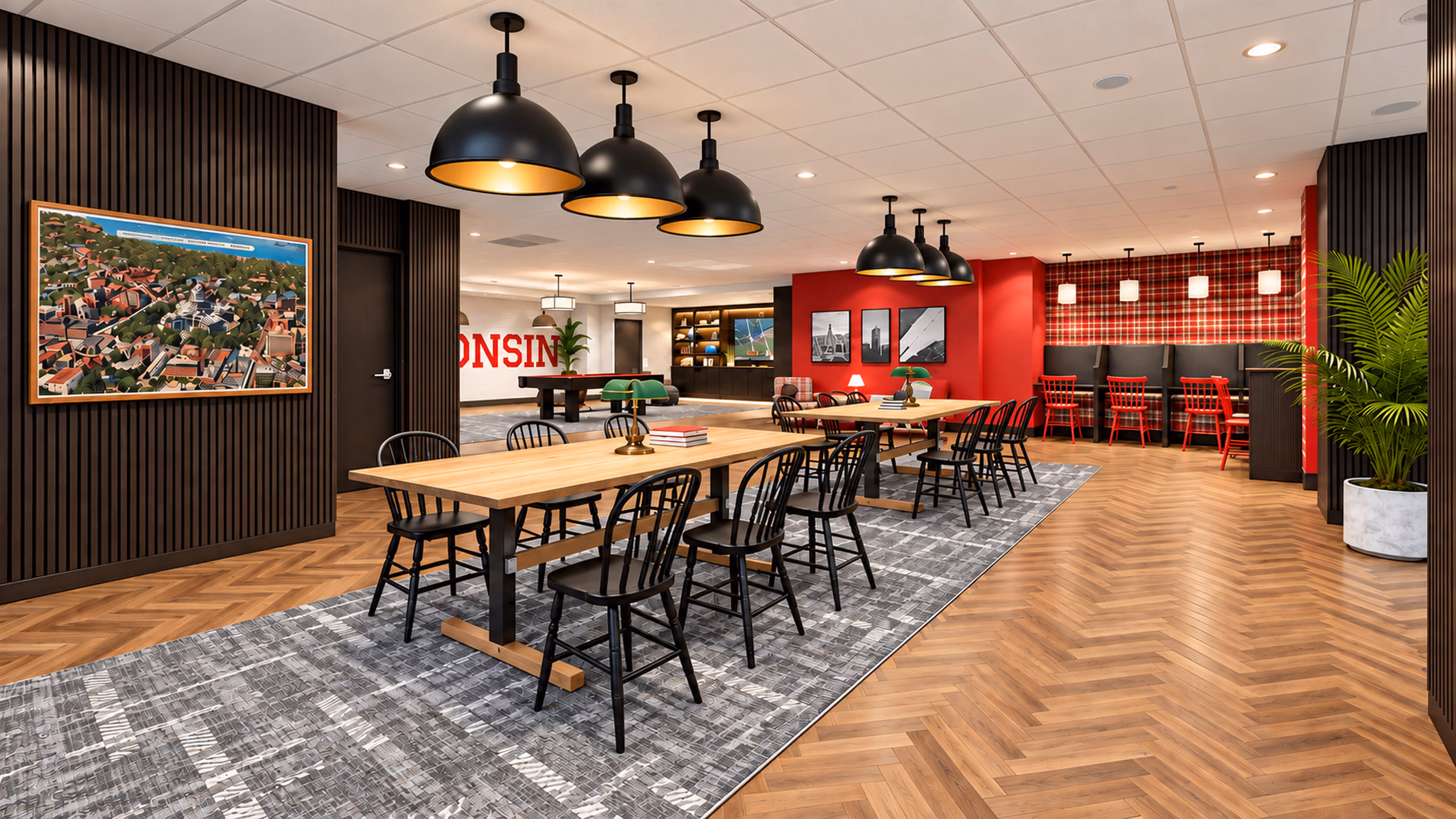 Buckner study lounge with long wood tables, black chairs, pendant lights and a campus aerial print