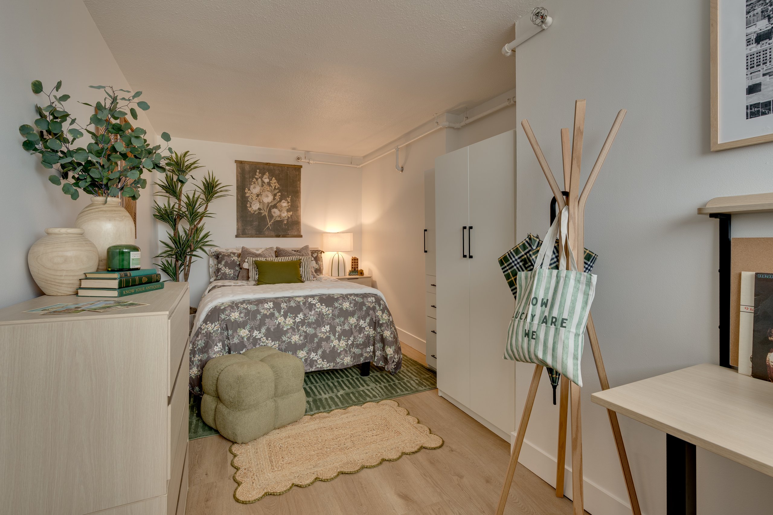 Furnished bedroom with full-size bed in a Buckner student apartment
