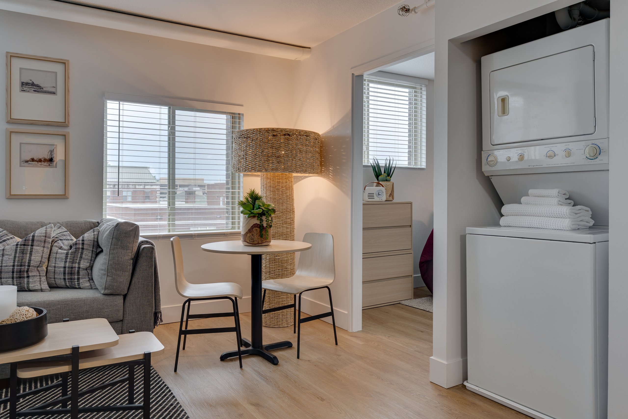 Dining area and in-unit washer and dryer in a Buckner student apartment