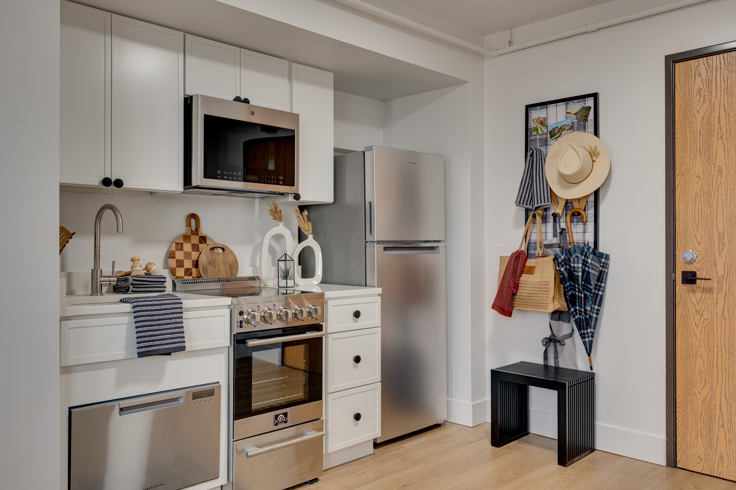 Kitchen next to the front door in a Buckner student apartment