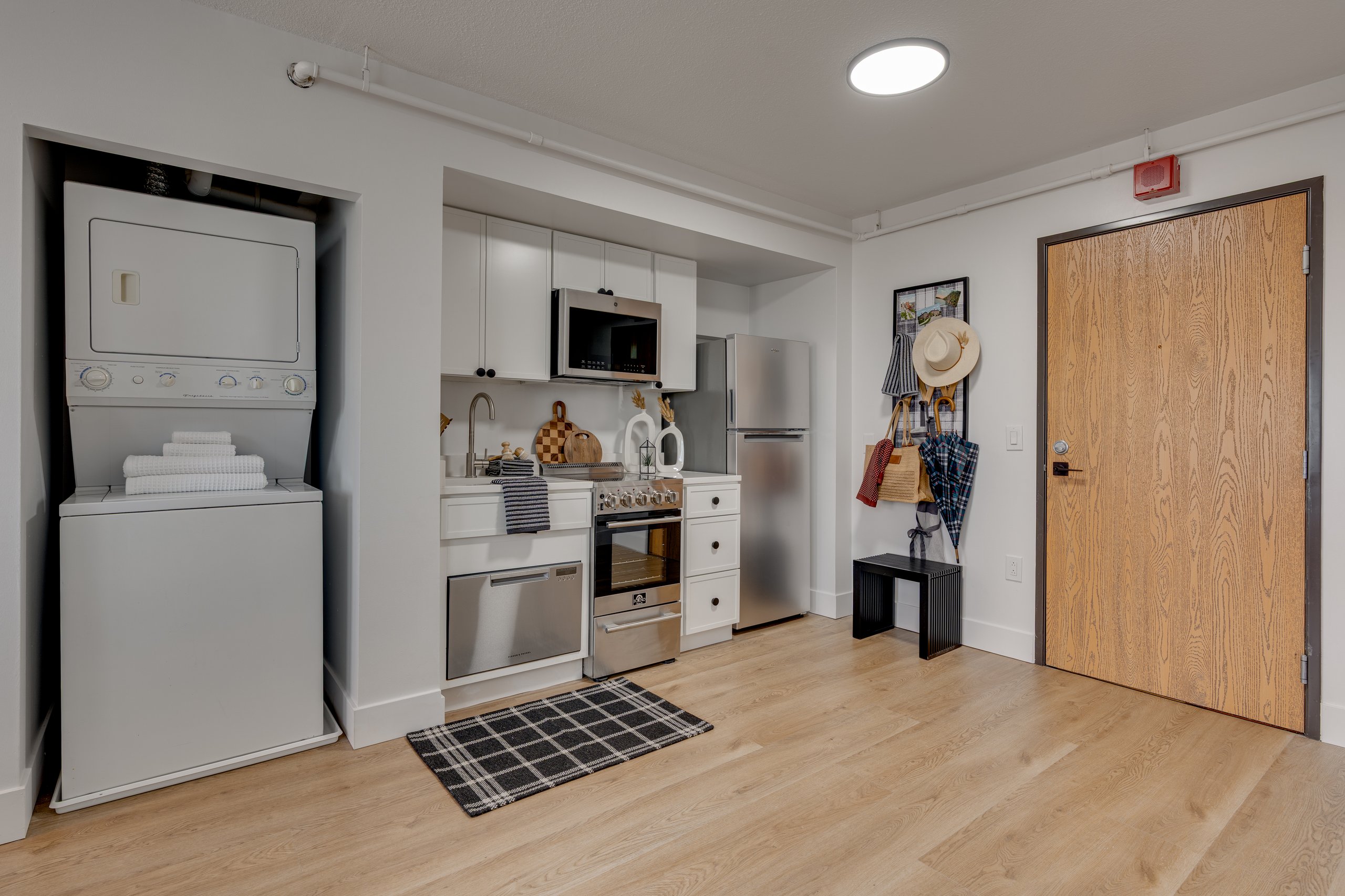 Kitchen and in-unit washer and dryer in a Buckner student apartment, Madison, WI