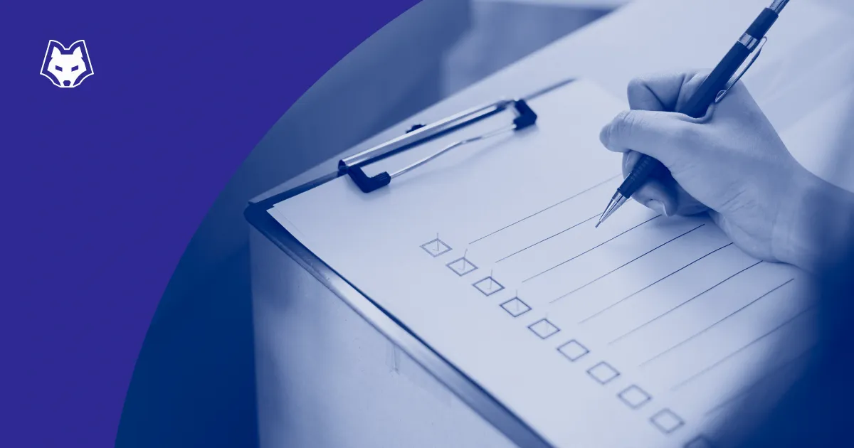 A hand ticking boxes on a checklist on a clipboard