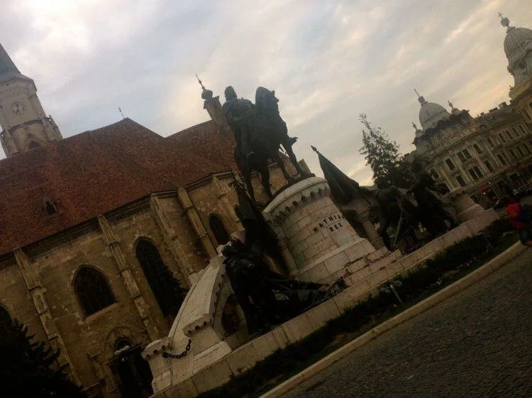Equestrian statue of Matthias Corvinus beside St. Michael's Church in Cluj-Napoca's main square, seen on the city tour