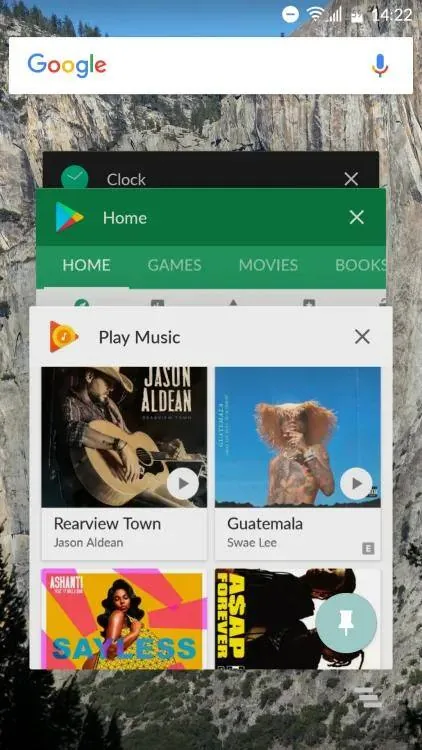 Android recent apps screen with Play Music in front and the pin button in the bottom corner used for screen pinning