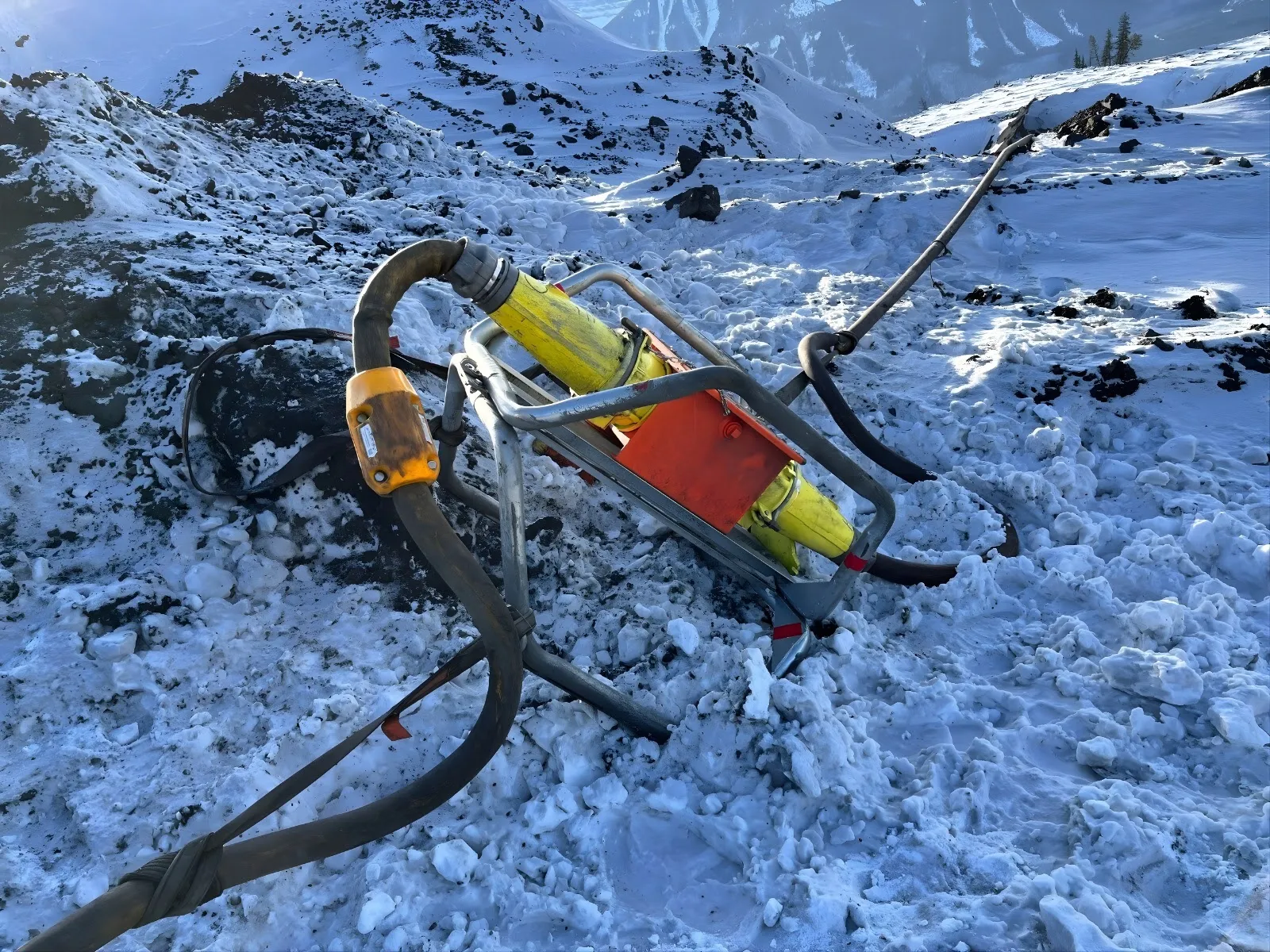 AcuSense node on a trailing cable at a snow-covered coupler sled