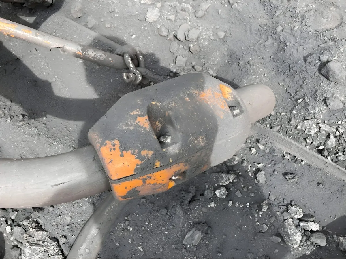 Weathered AcuSense node on a trailing cable lying on the bench