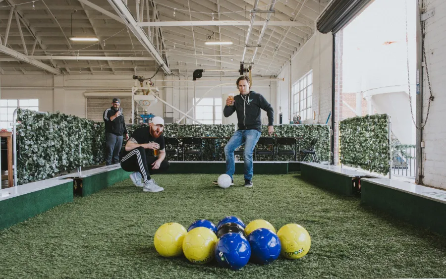 Giant soccer pool table played with your feet at TURF ATX