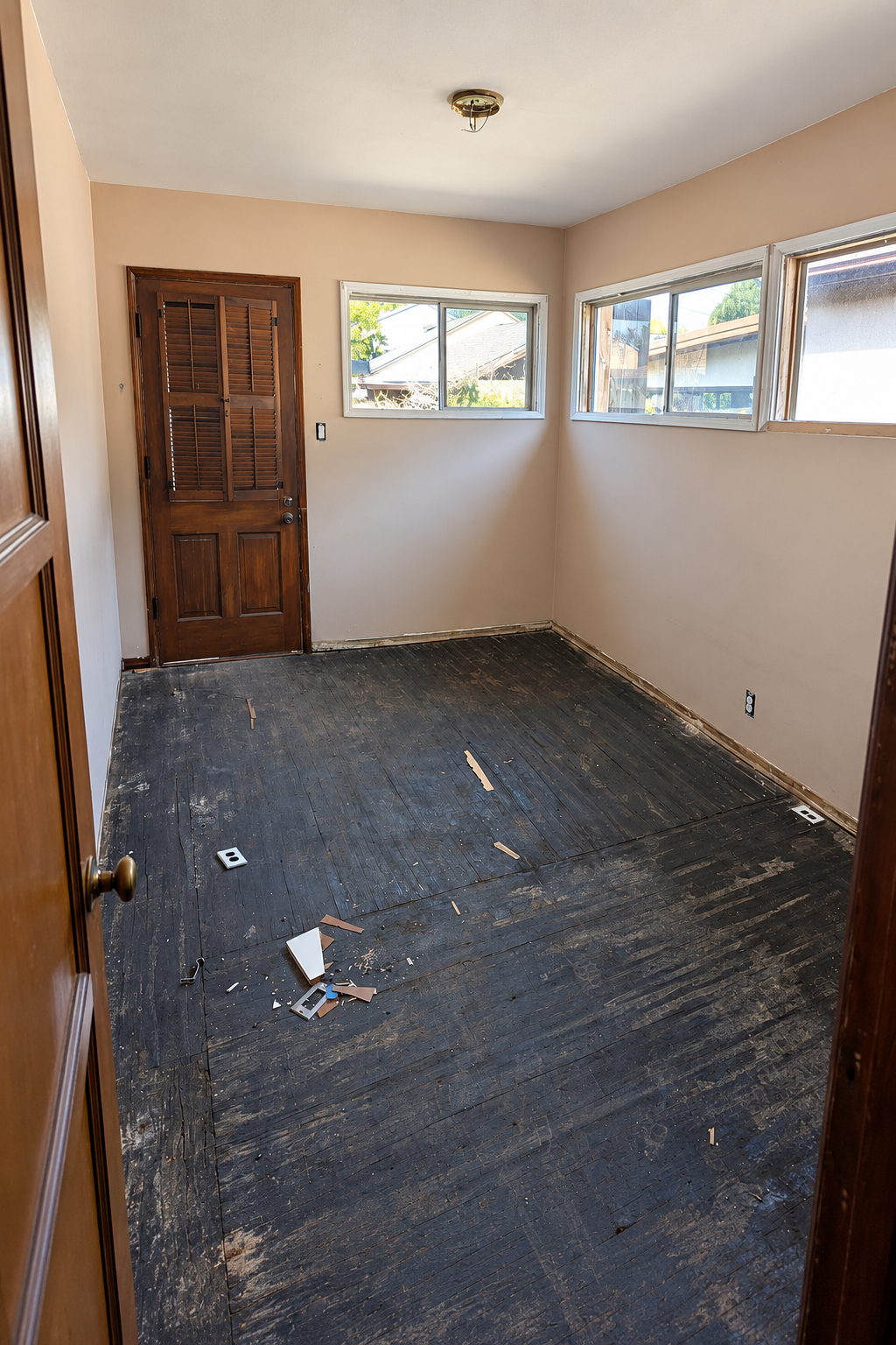 Bedroom during preparation, cleared with flooring work underway