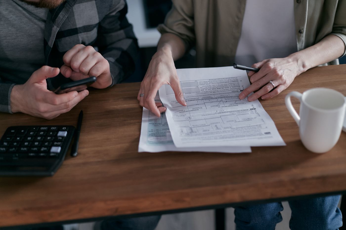 Two people reviewing paperwork at a table