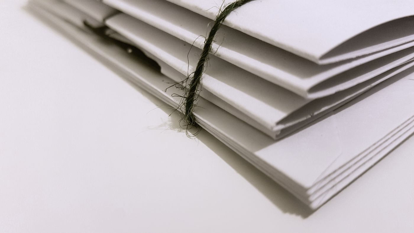 A bundle of envelopes tied with string