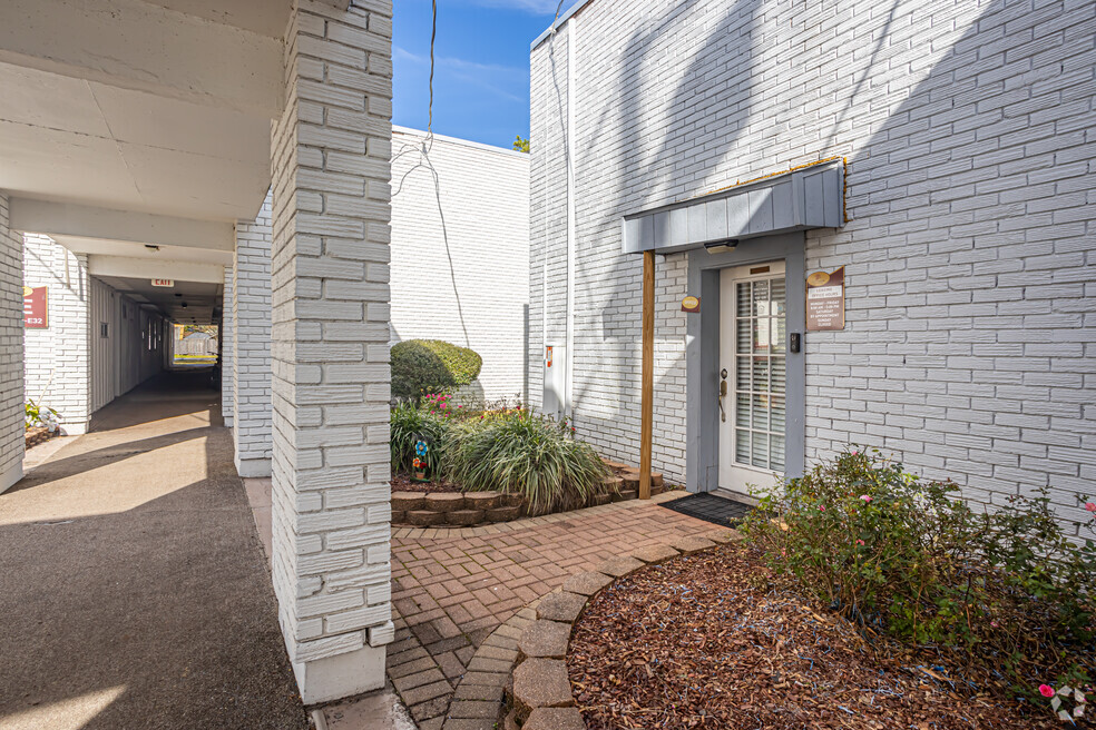 Exterior of building with sidewalk
