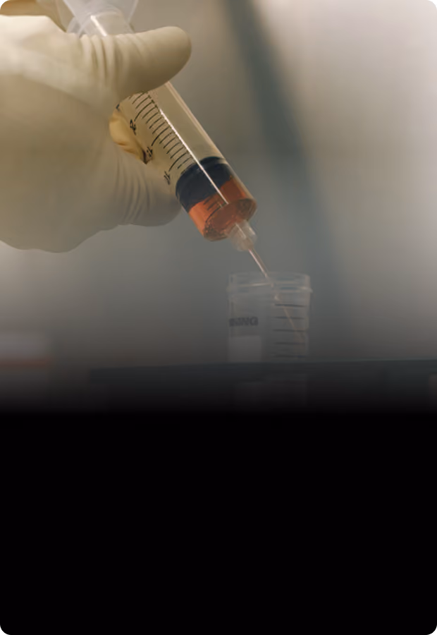 Hand dispensing sample from a syringe