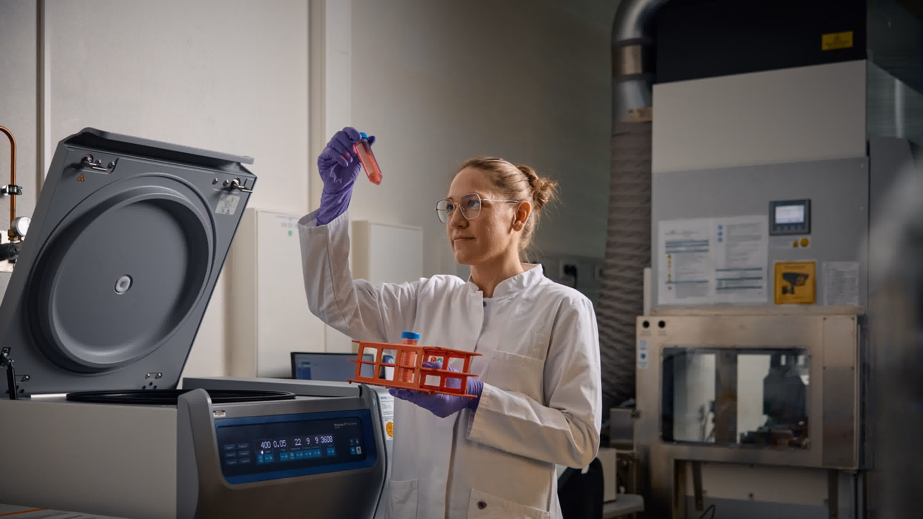 Female scientist viewing a sample in the lab
