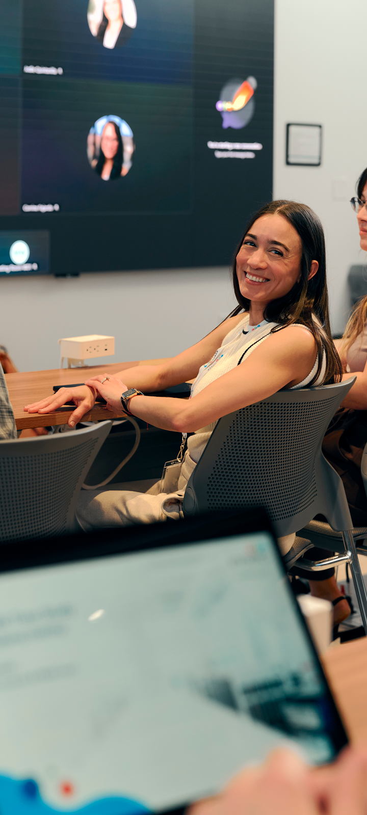 Immatics team members smiling in an office presentation