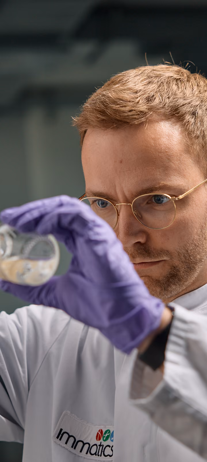Immatics scientist dispensing from a syringe