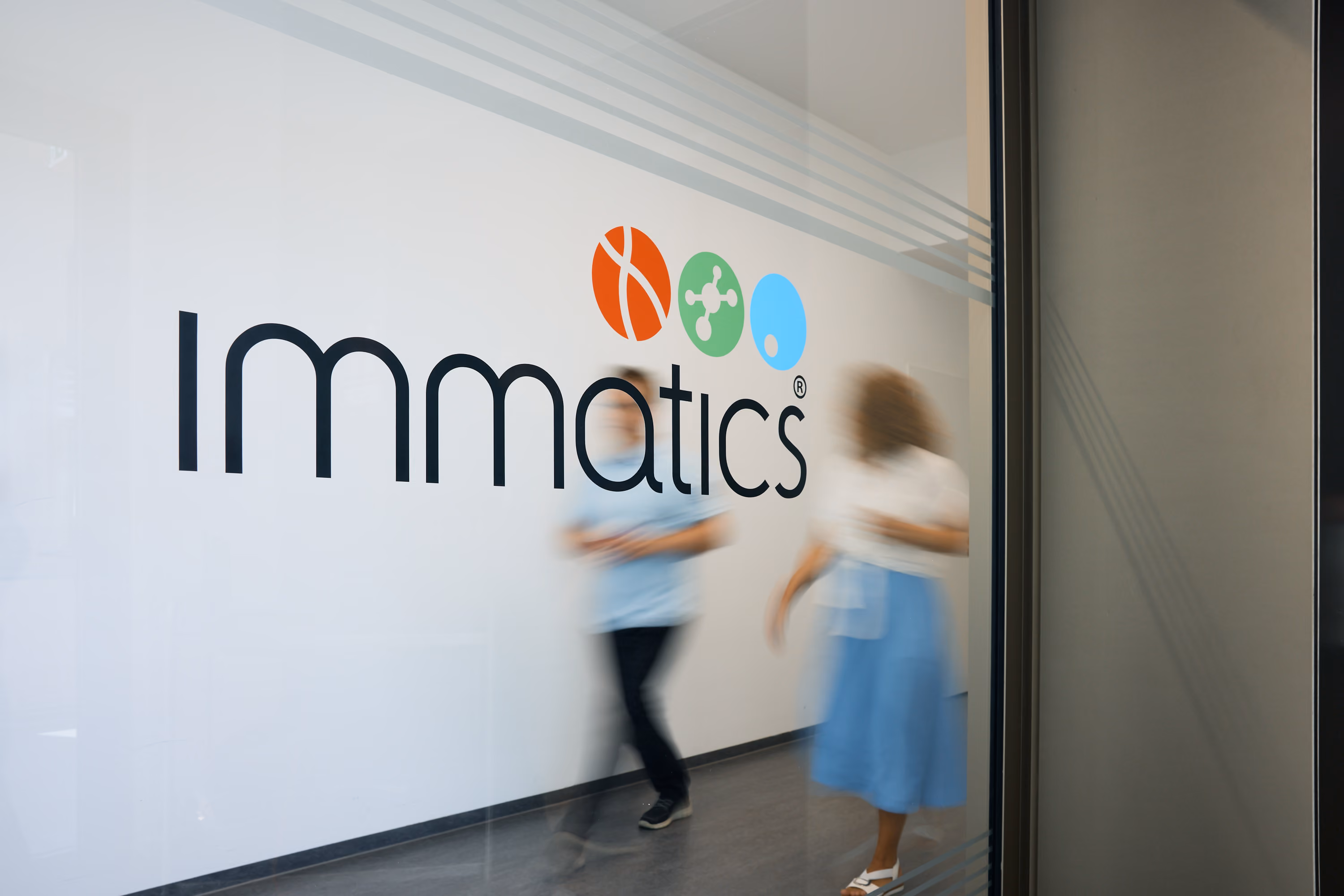 Person walking down hallway at Immatics office
