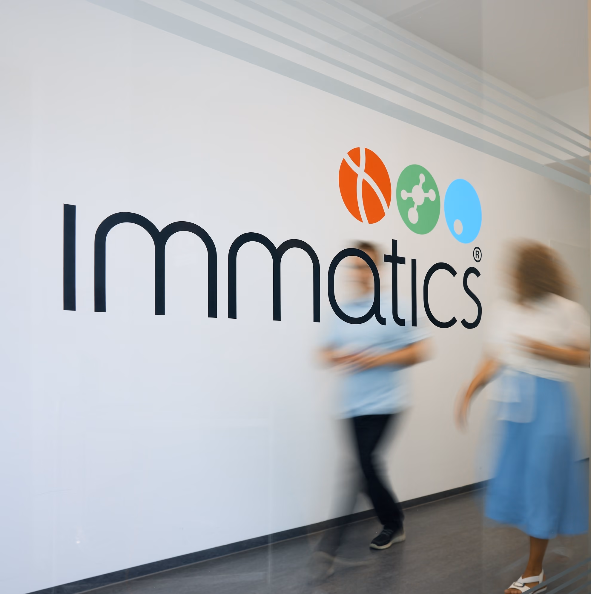 Person walking down hallway at Immatics office