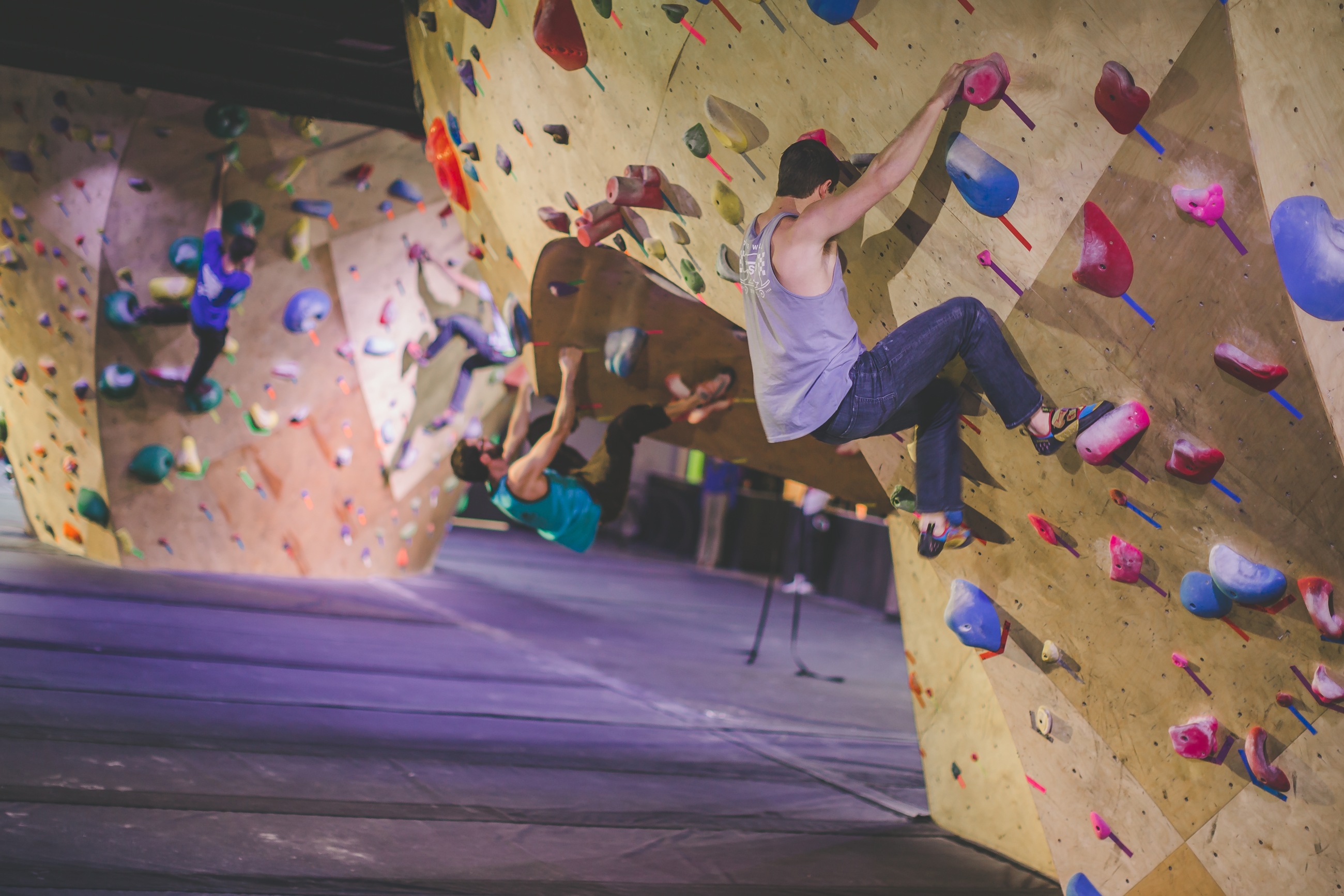 Climbers on the indoor bouldering wall at BaseCamp