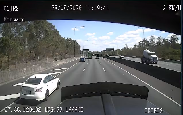 Forward-facing camera view from a truck travelling on a multi-lane motorway