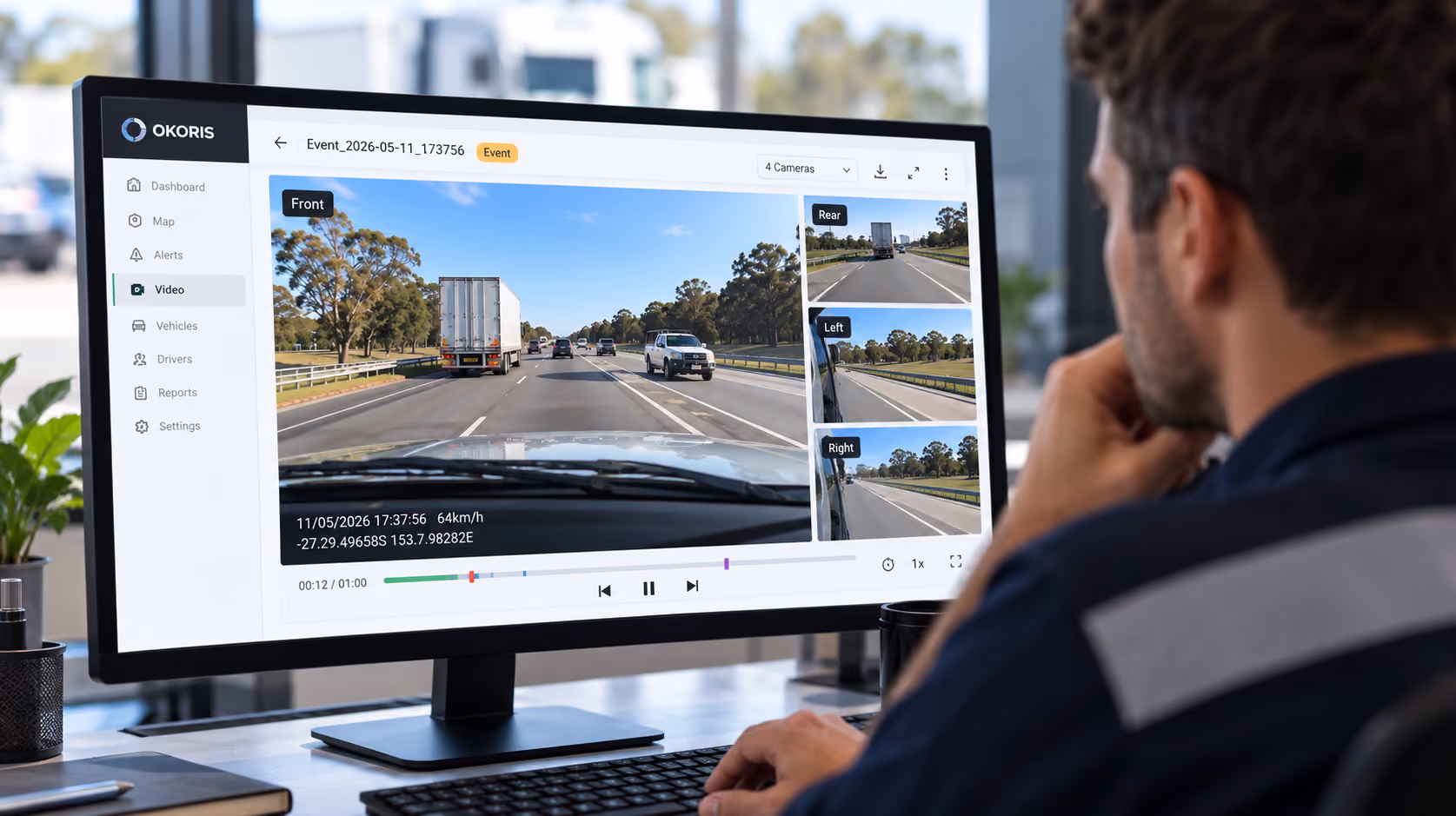 Fleet operator reviewing footage on a tablet in a monitoring centre
