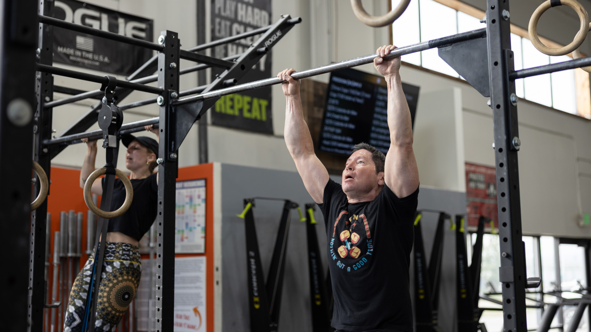 Man performing a pull-up during a CrossFit class at Sundog CrossFit in Fairbanks, Alaska.