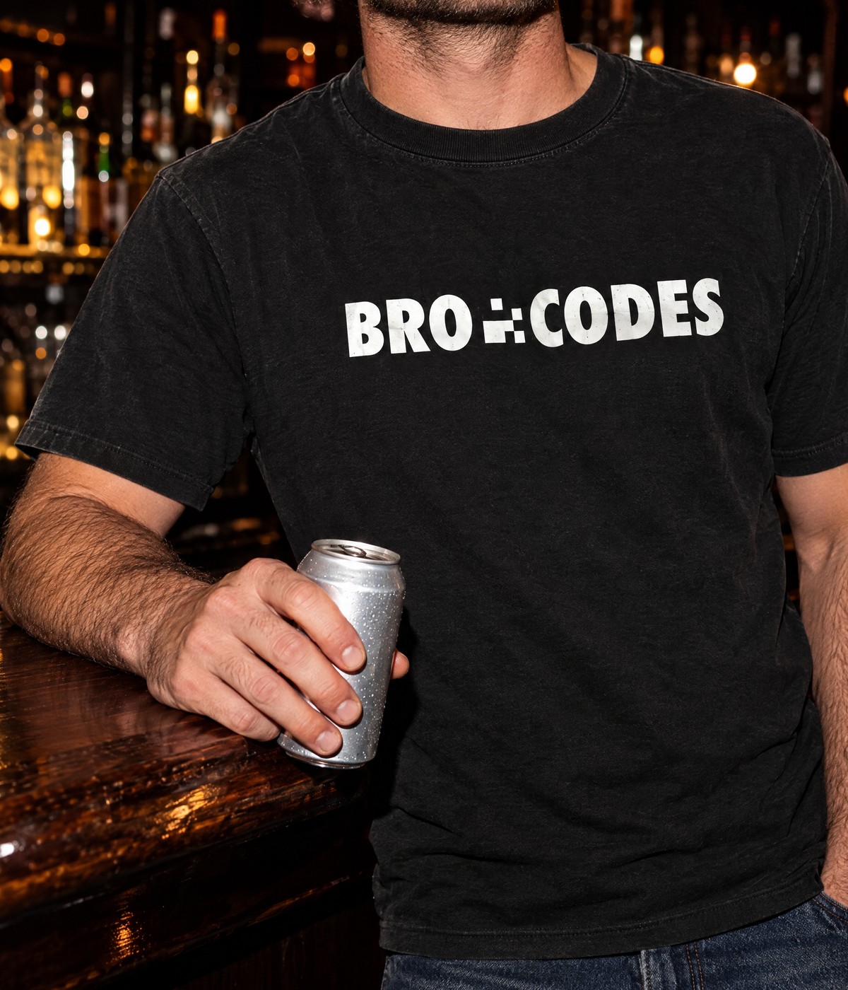 Man at a bar wearing the black Bro Codes logo tee