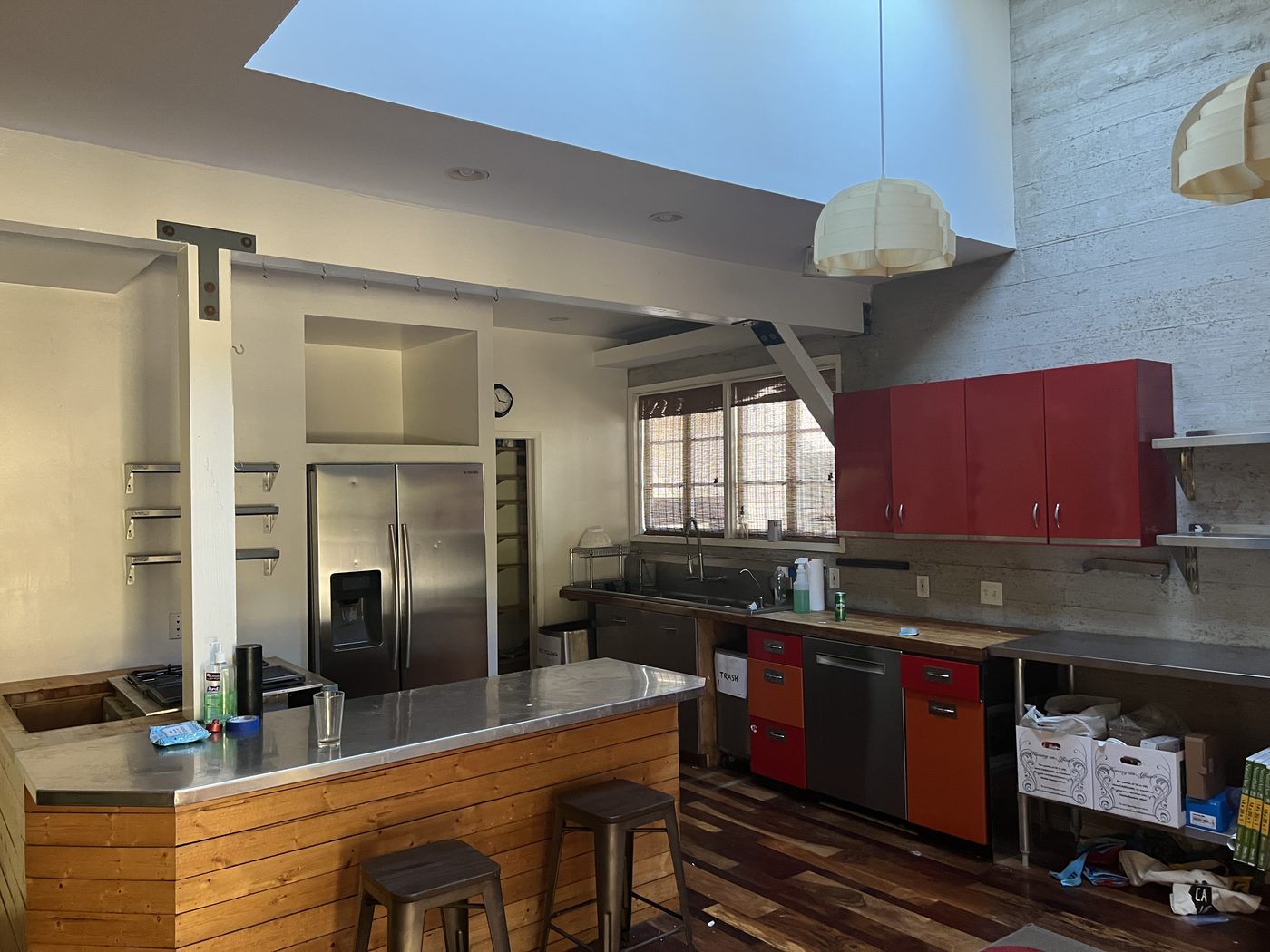 Los Feliz kitchen before prep: cluttered counters and boxes on the floor