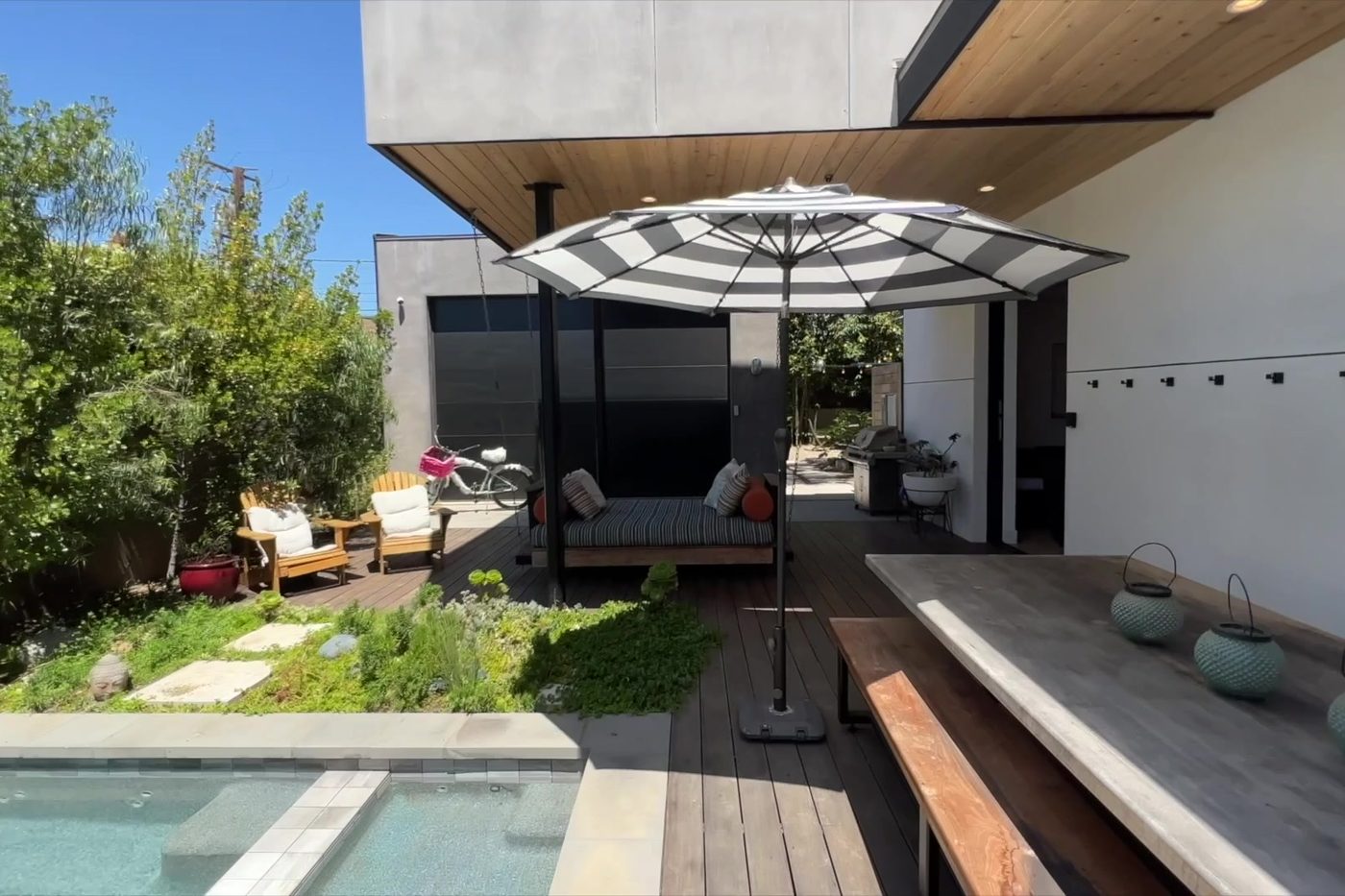The Modern Monica covered patio and wood deck beside the spa.