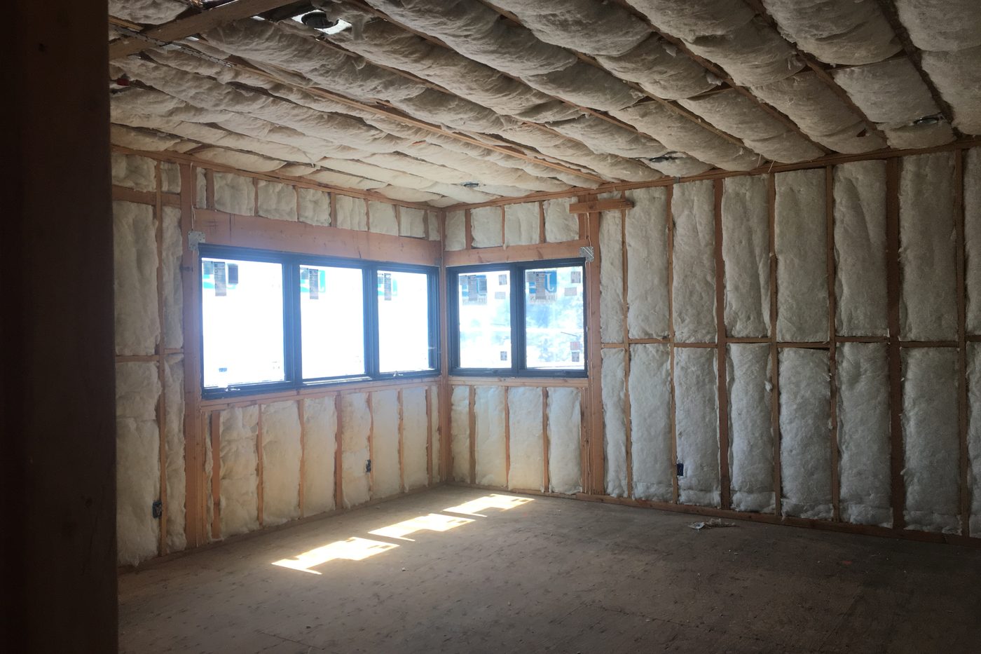 The Modern Monica during construction: insulated walls and ceiling before drywall.
