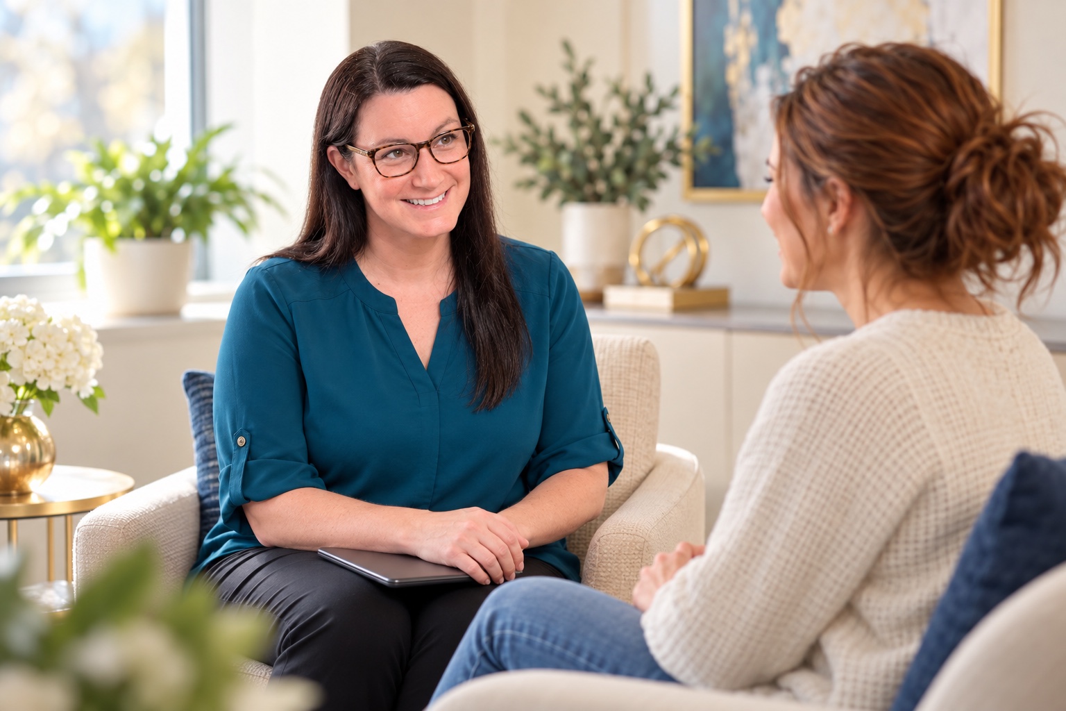 Sandy Lynn Laucella listening to a patient during a fertility care follow-up
