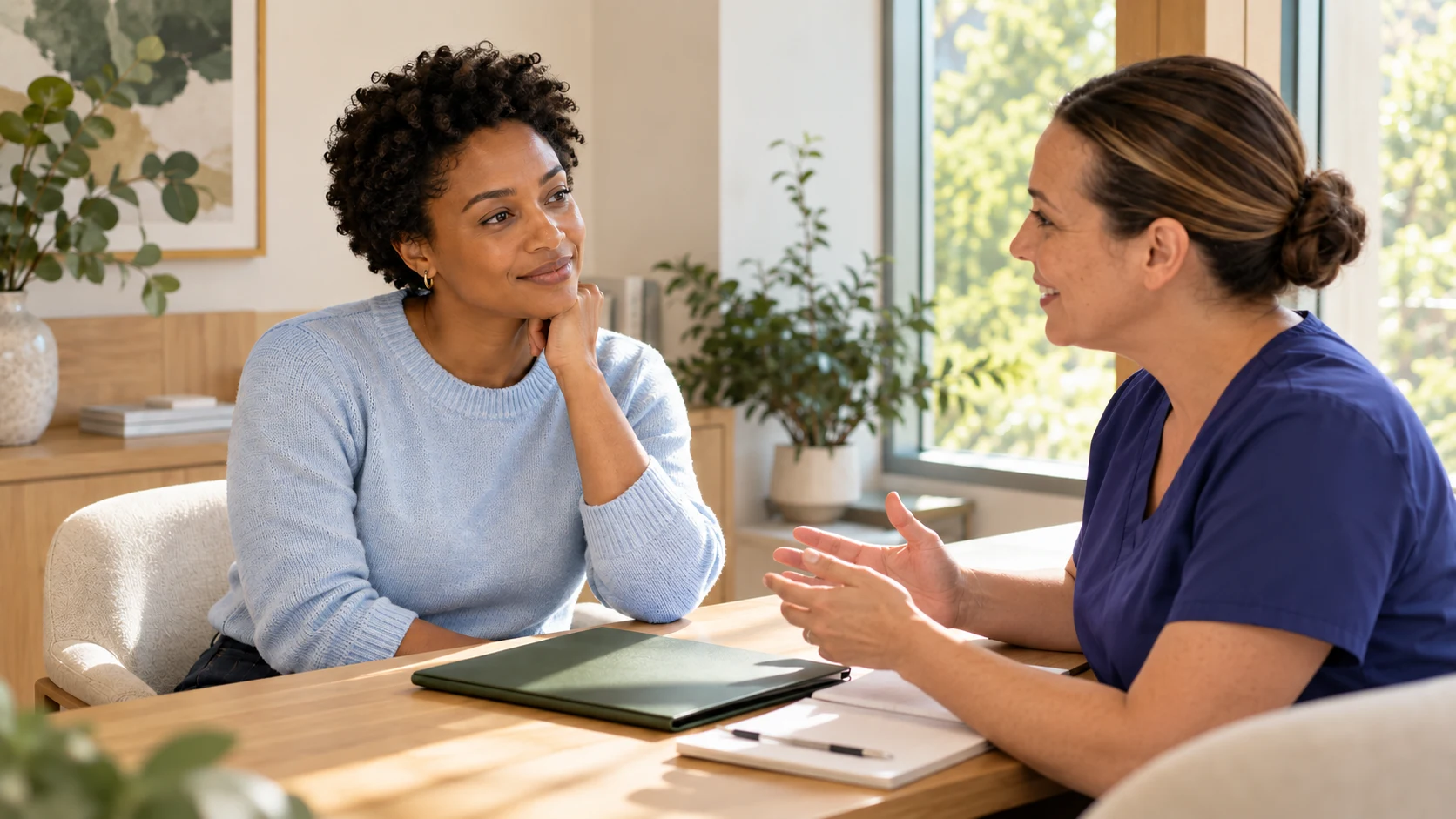 A woman discussing care planning with a clinical coordinator.