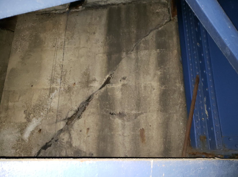 Cracked reinforced-concrete abutment wall