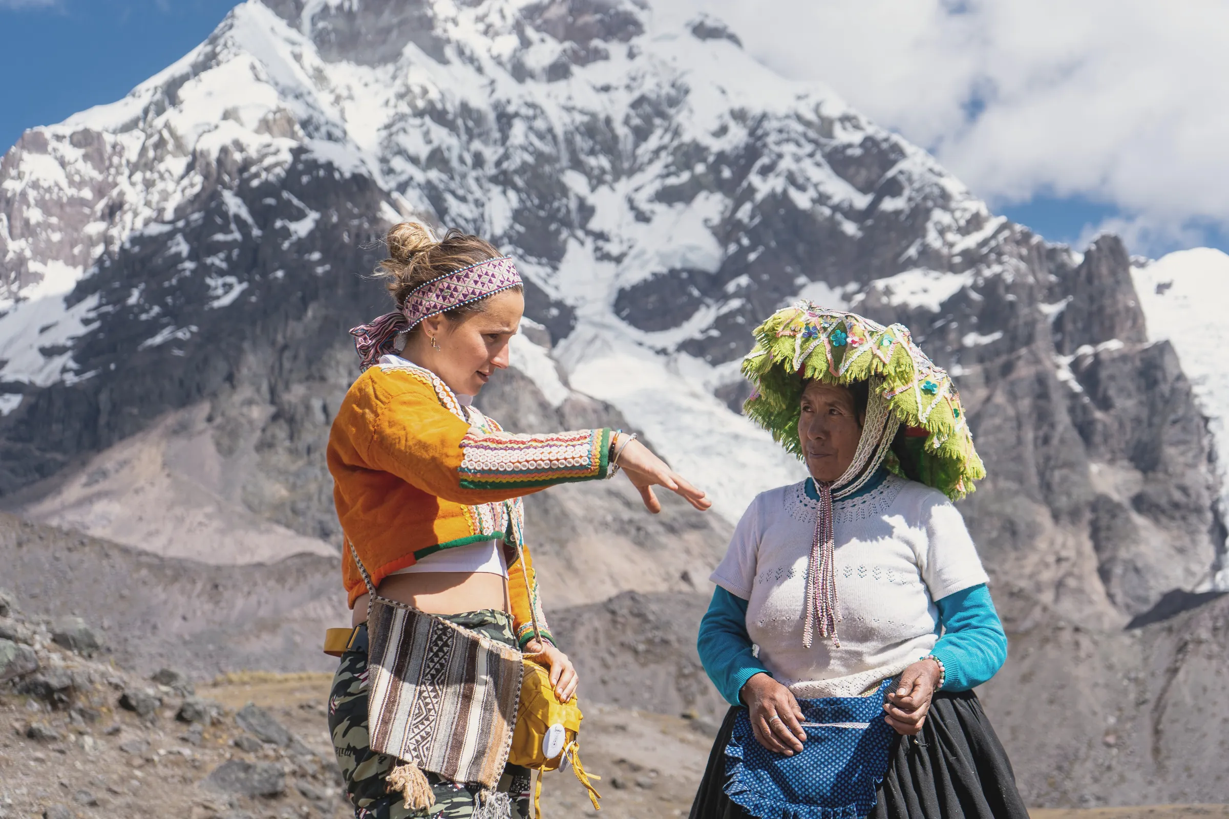 Traveler with a Quechua woman near Ausangate in Peru