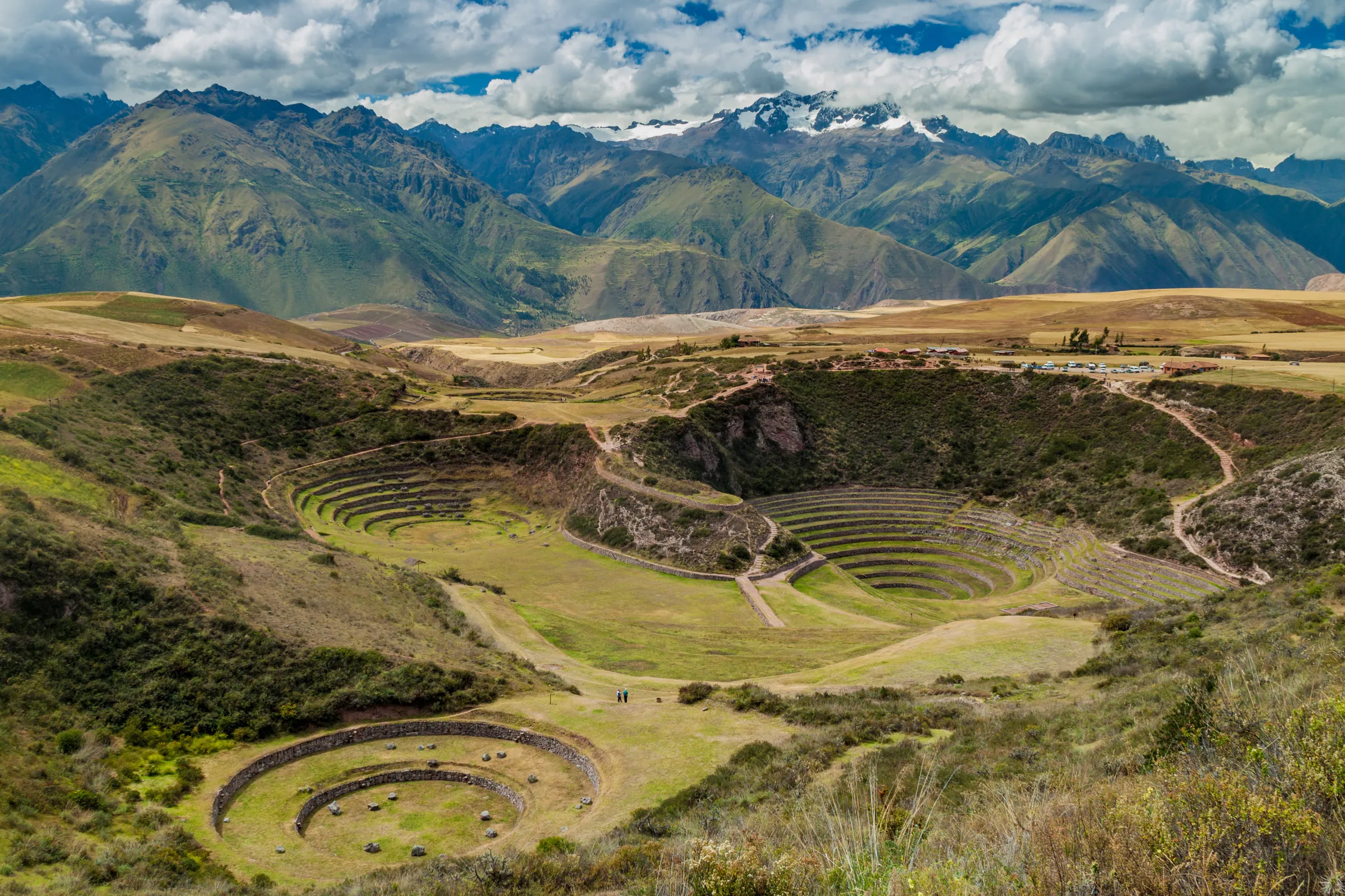 Circular agricultural terraces amid mountain grassland