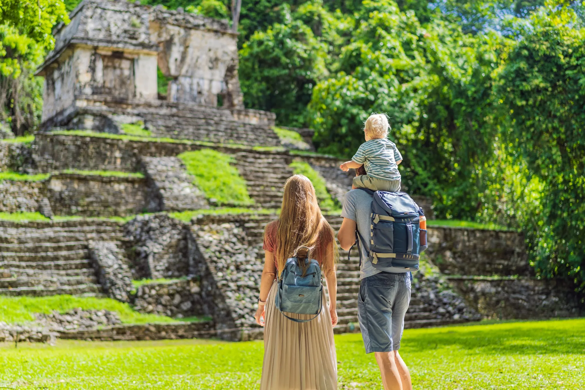 Family visiting Maya ruins.