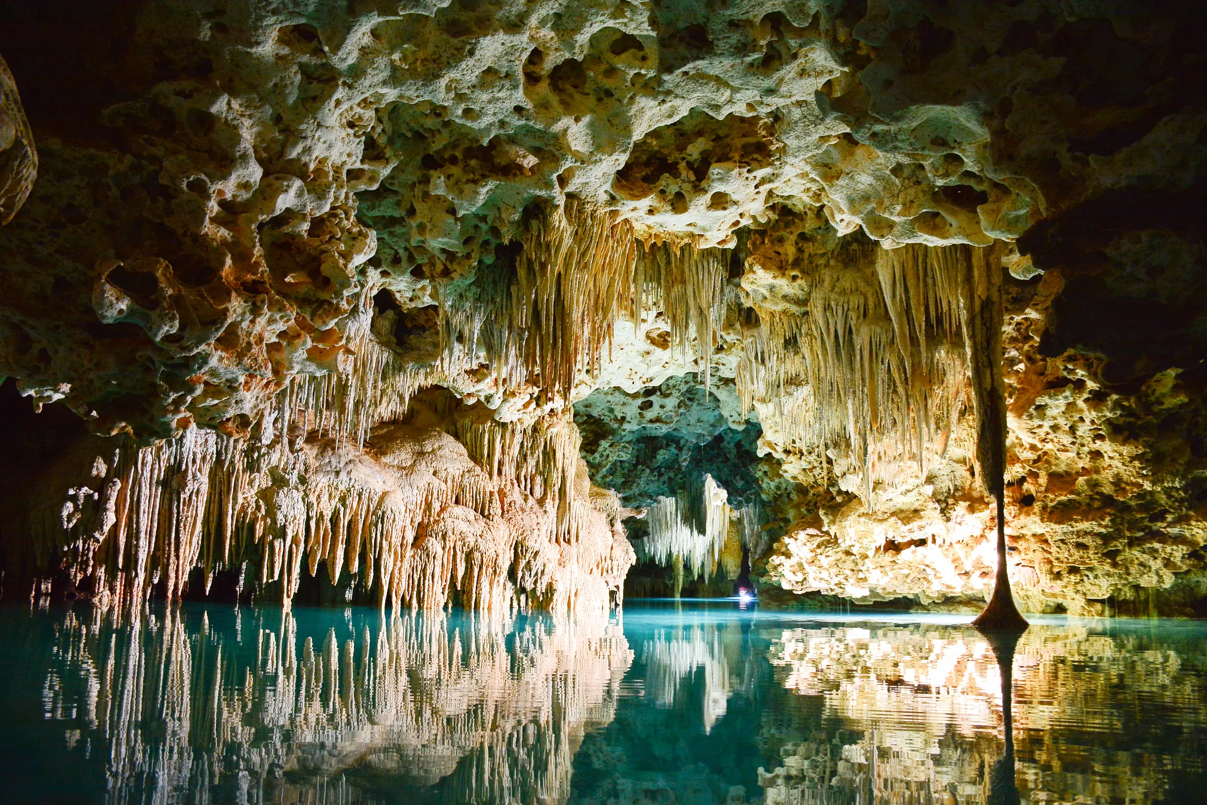 Cave formations reflected in a still pool