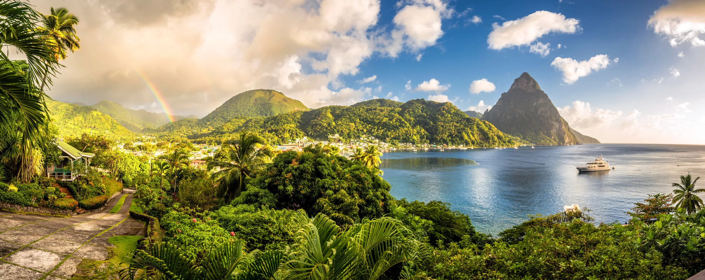 Tropical bay with lush hills and distant peaks
