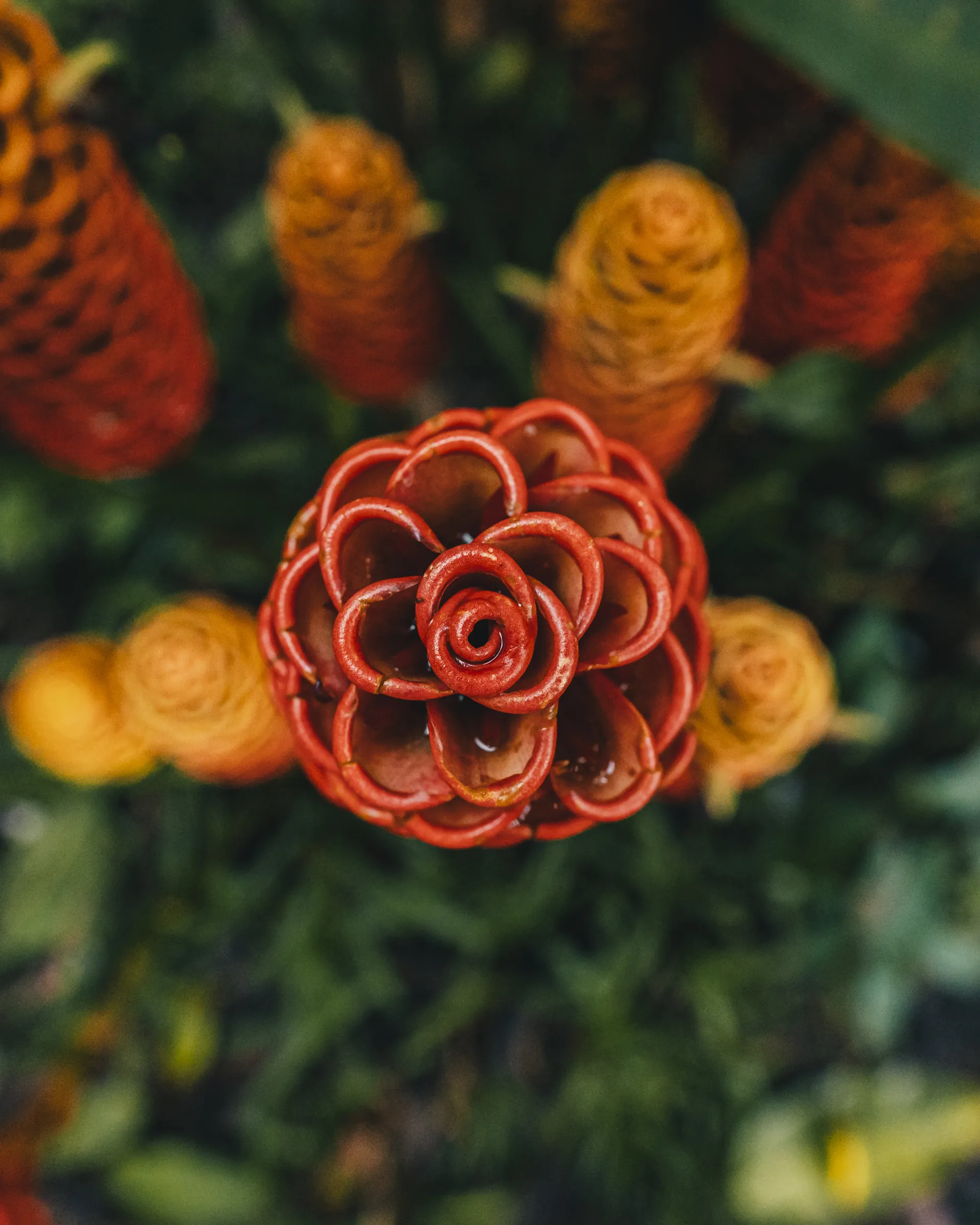 Colorful folded fabric flowers at a market
