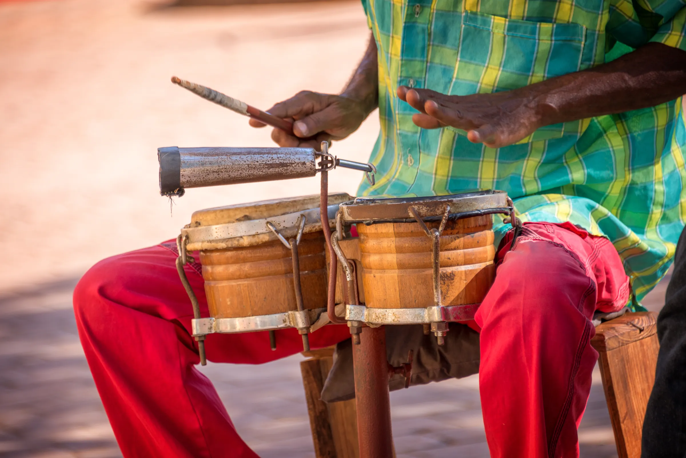 Musician playing a pair of small drums