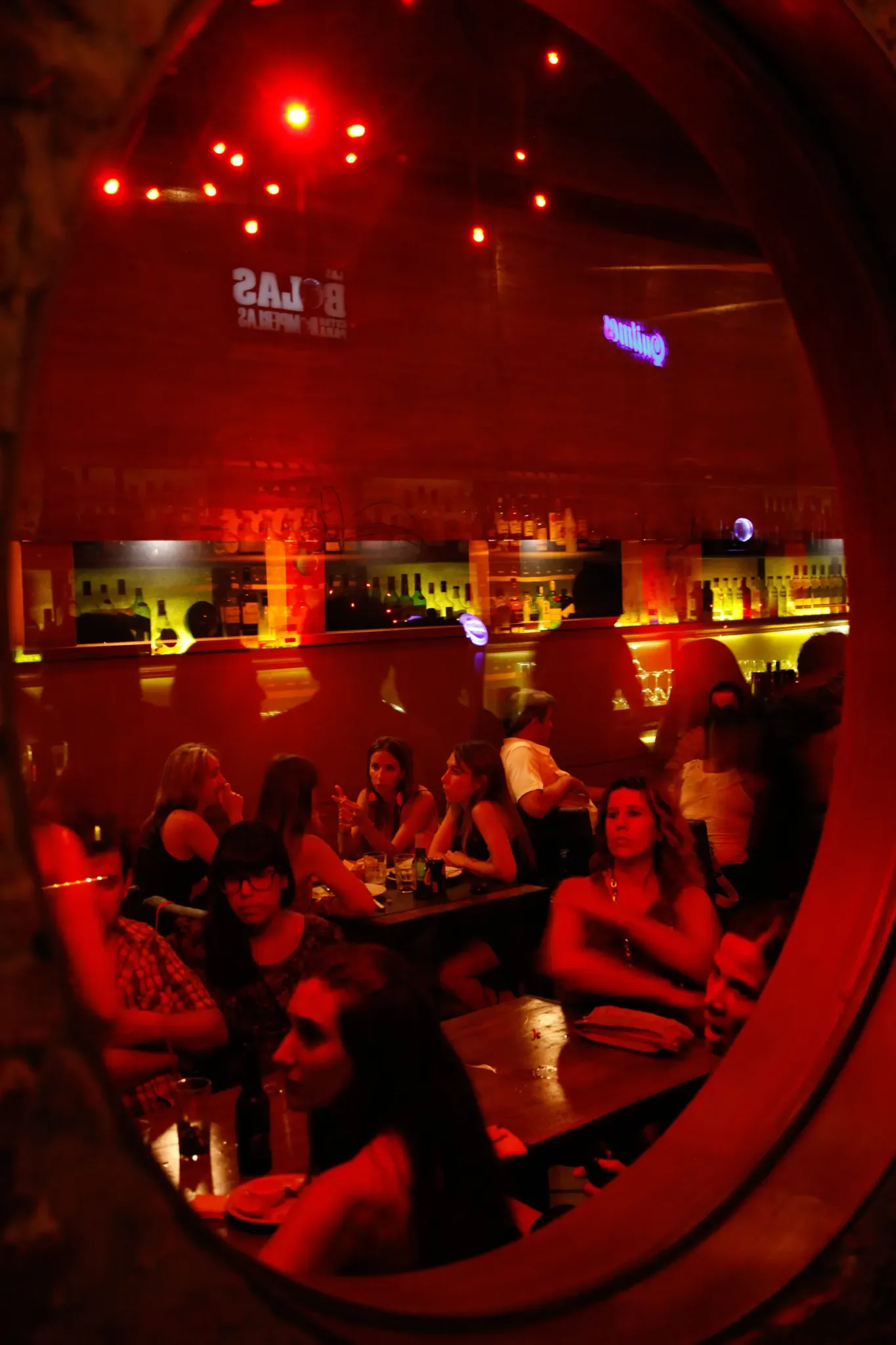 Nightlife reflected in a bar mirror in Argentina