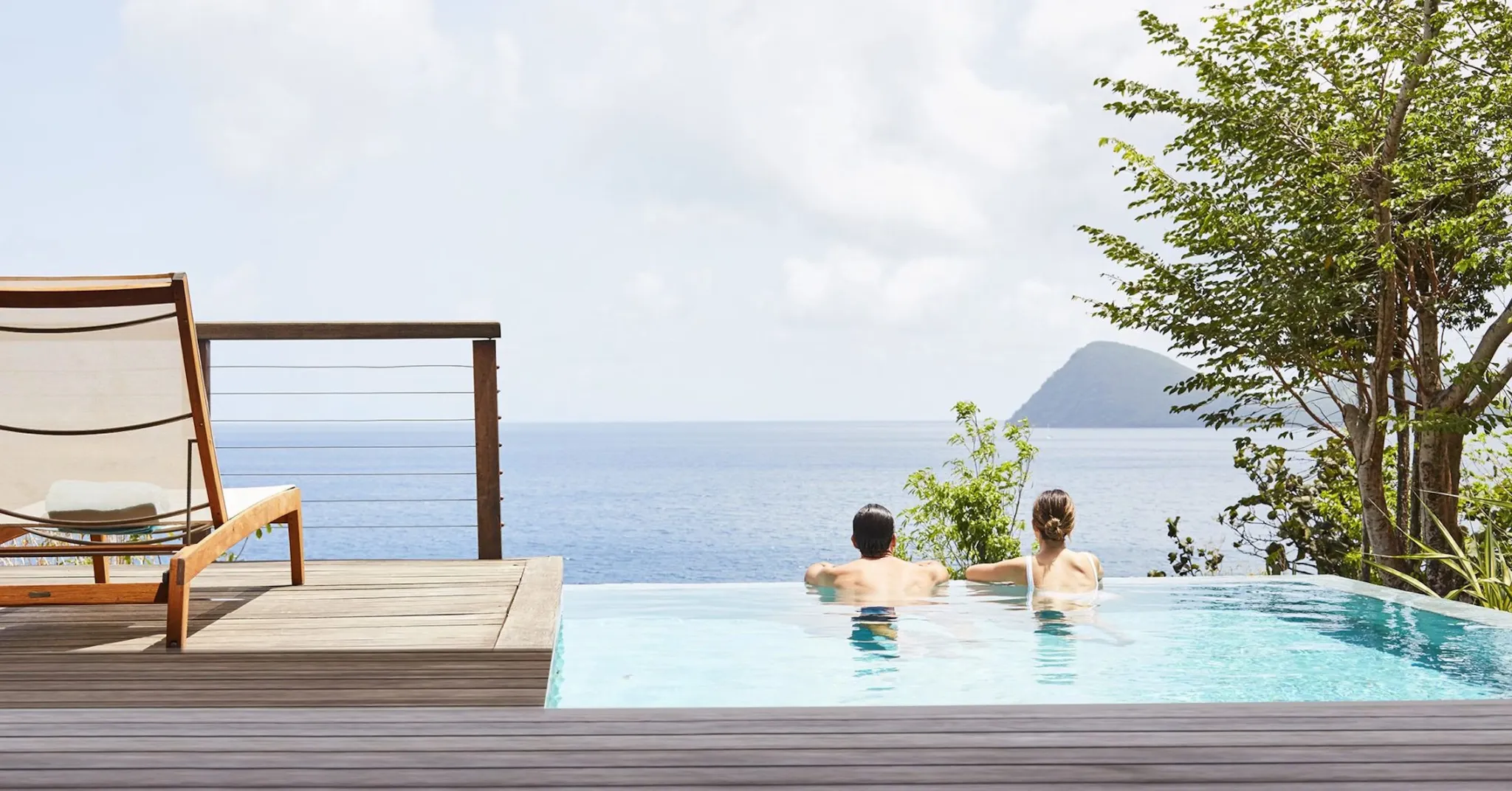 Couple in a private pool at Secret Bay in Dominica