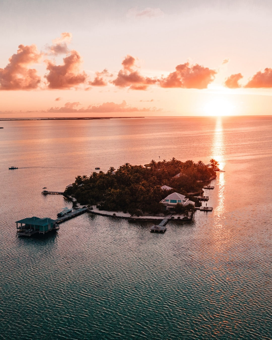 Cayo Espanto private island and overwater villa at sunset, Belize