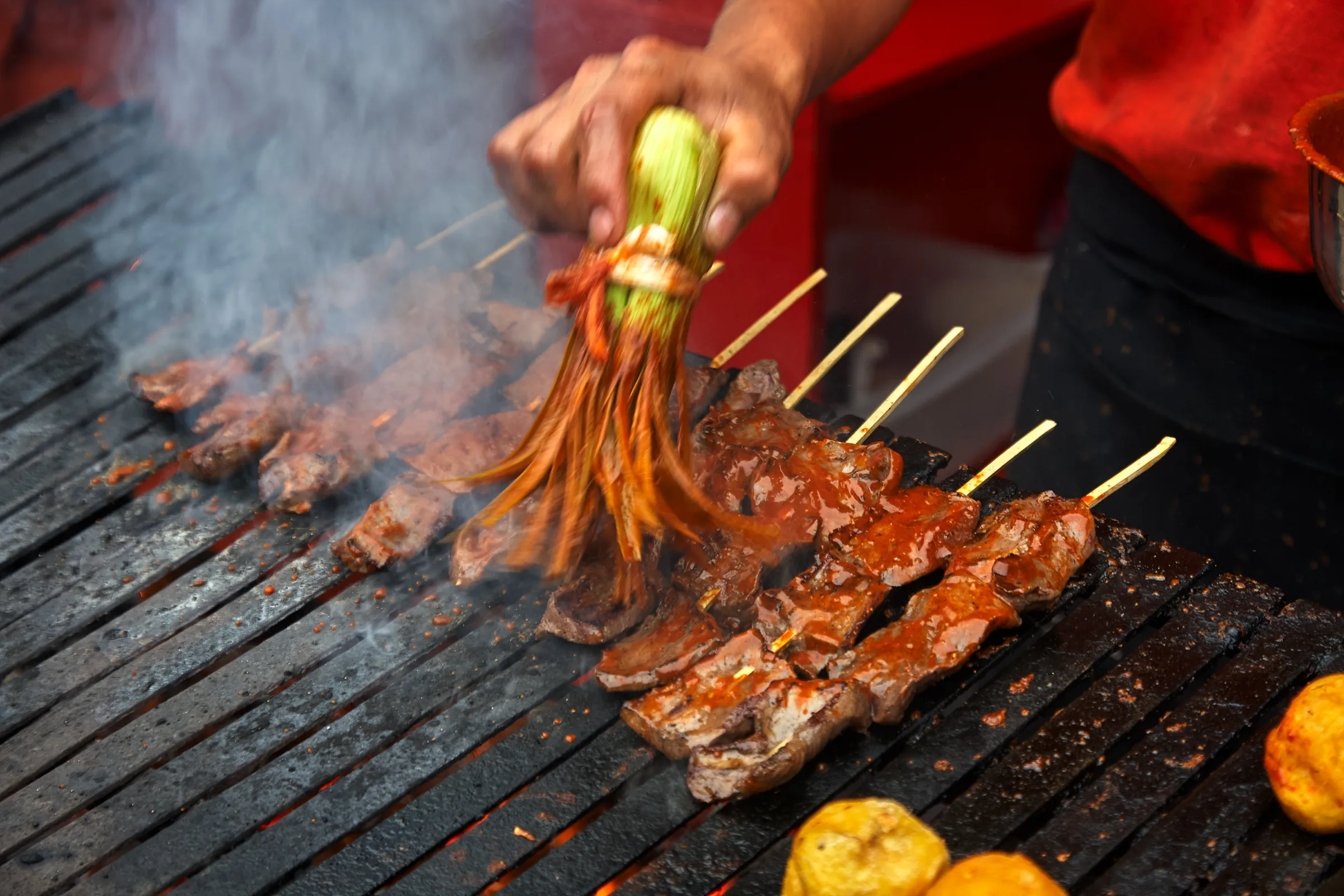 Anticuchos grilling at a street stall in Lima, Peru