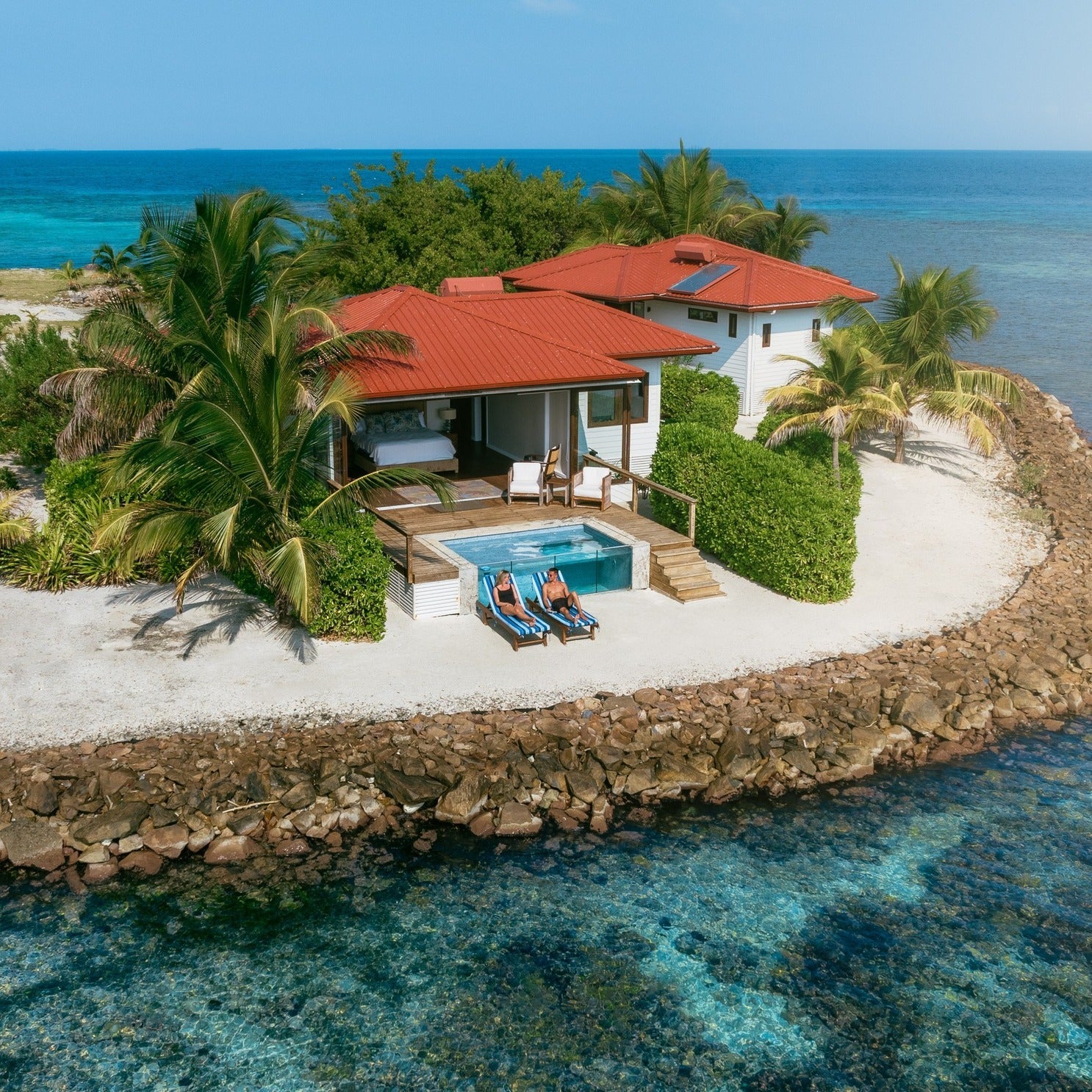 Beachfront villa and small pool on Ray Caye in Belize.