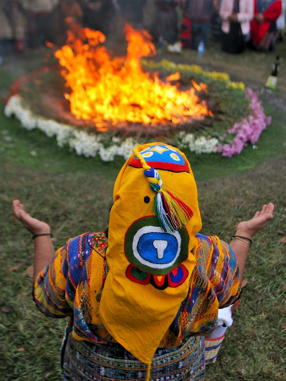 Colorful candles and offerings burn at a traditional Mayan fire ceremony in Guatemala.