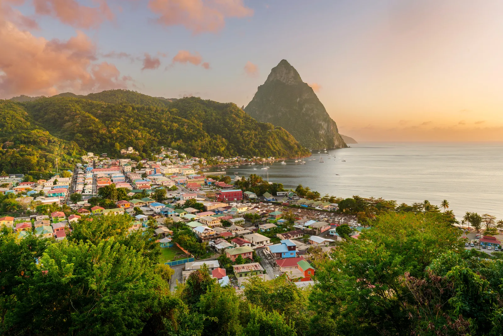 Soufrière and Petit Piton at sunset, seen from the hills above town, St. Lucia.