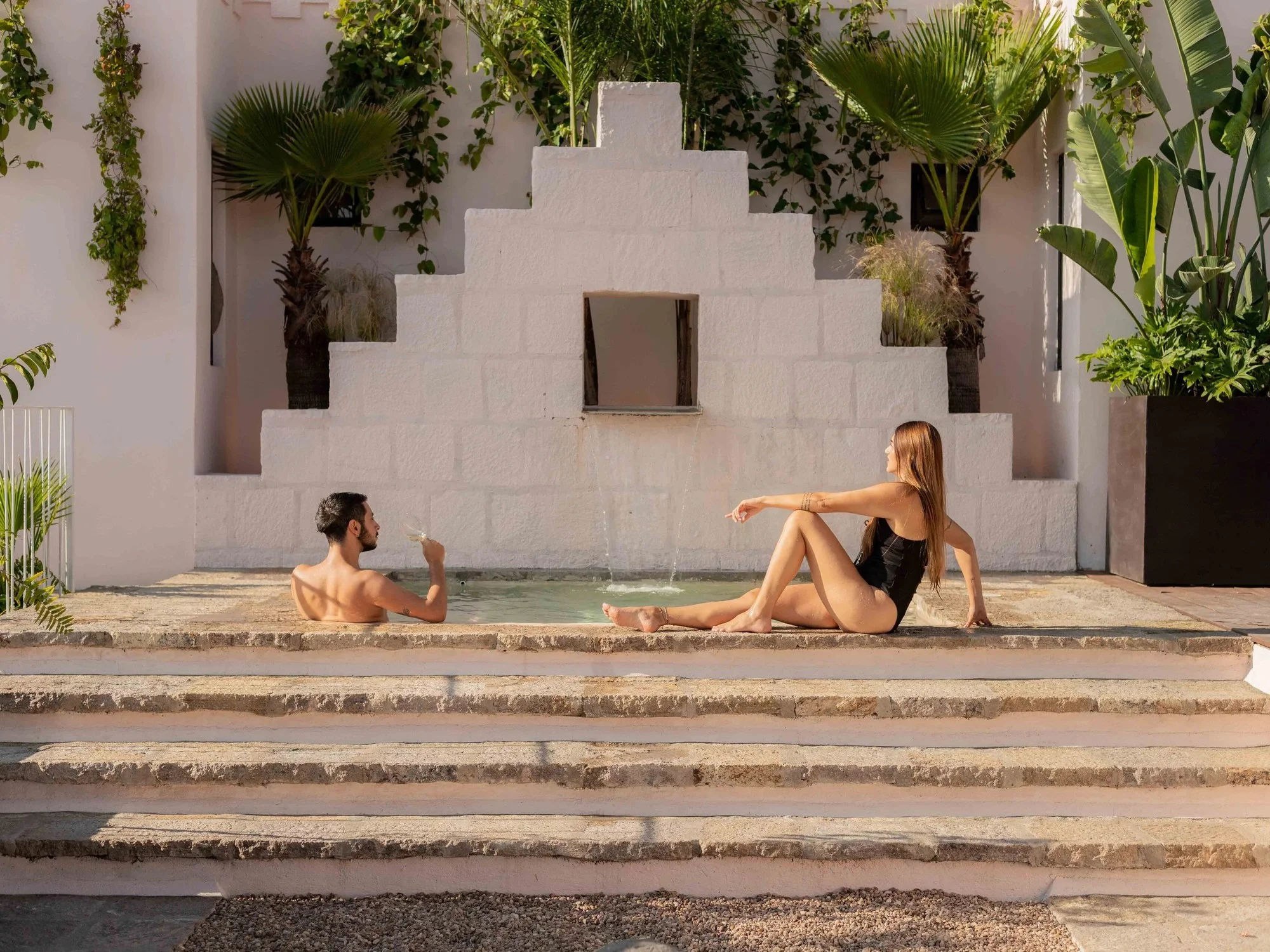 Couple relaxing by the pool at La Valise in Mexico