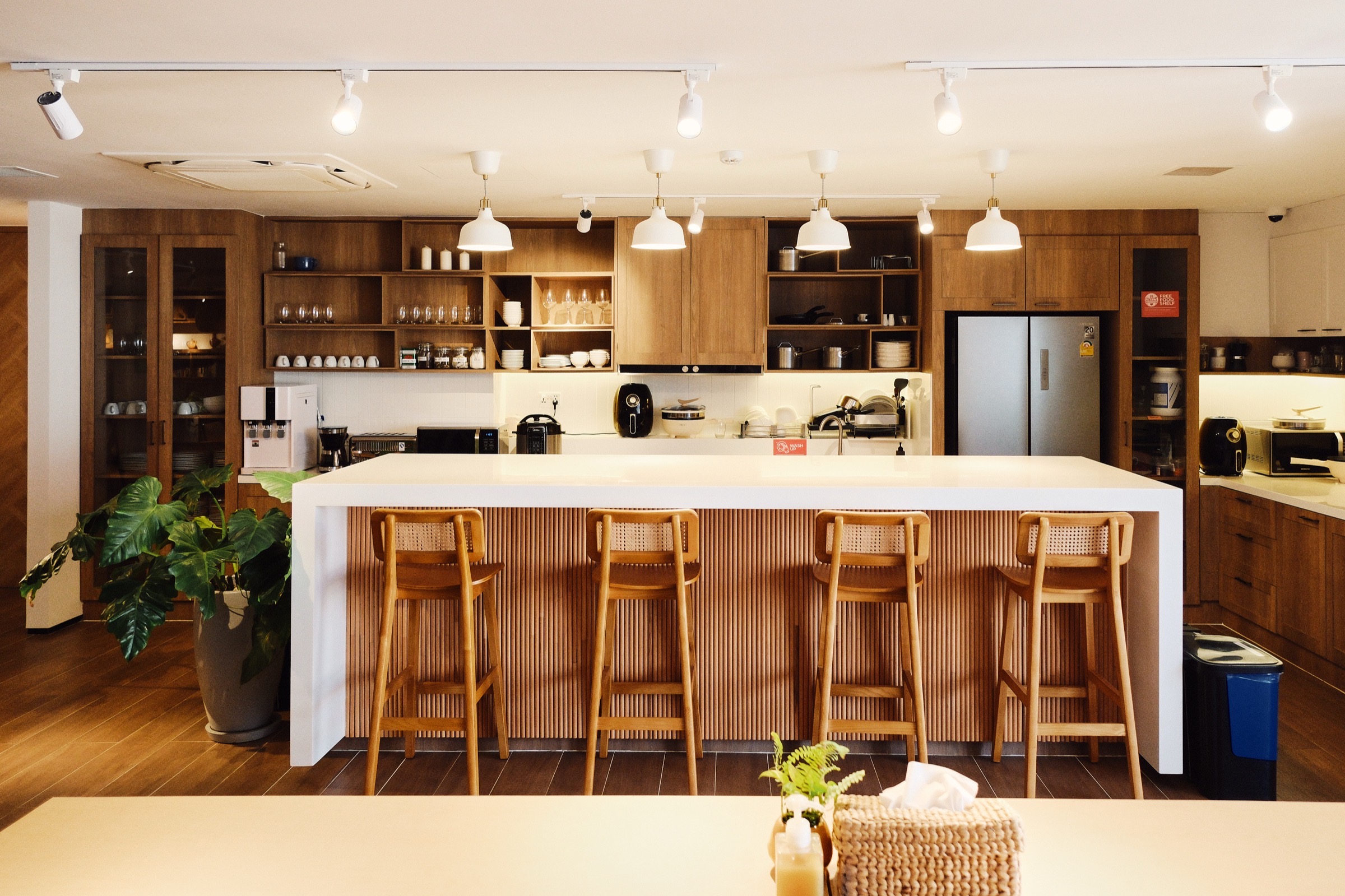 The shared kitchen and island at Commune Live